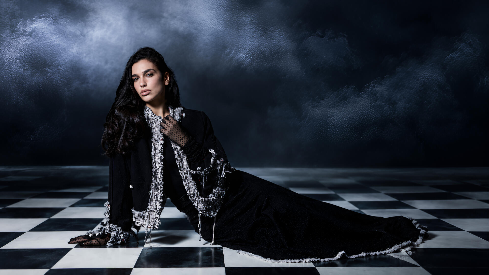 Moody portrait of a female singer in a black gown on a checkerboard floor beneath stormy clouds — music-themed 4K Ultra HD PC desktop wallpaper/background.