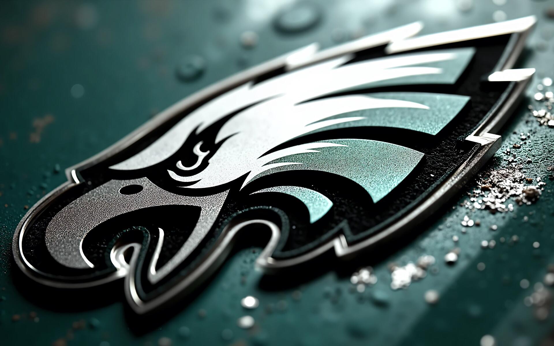Philadelphia Eagles NFL logo close-up on a textured metallic green surface — 4K Ultra HD PC desktop wallpaper background