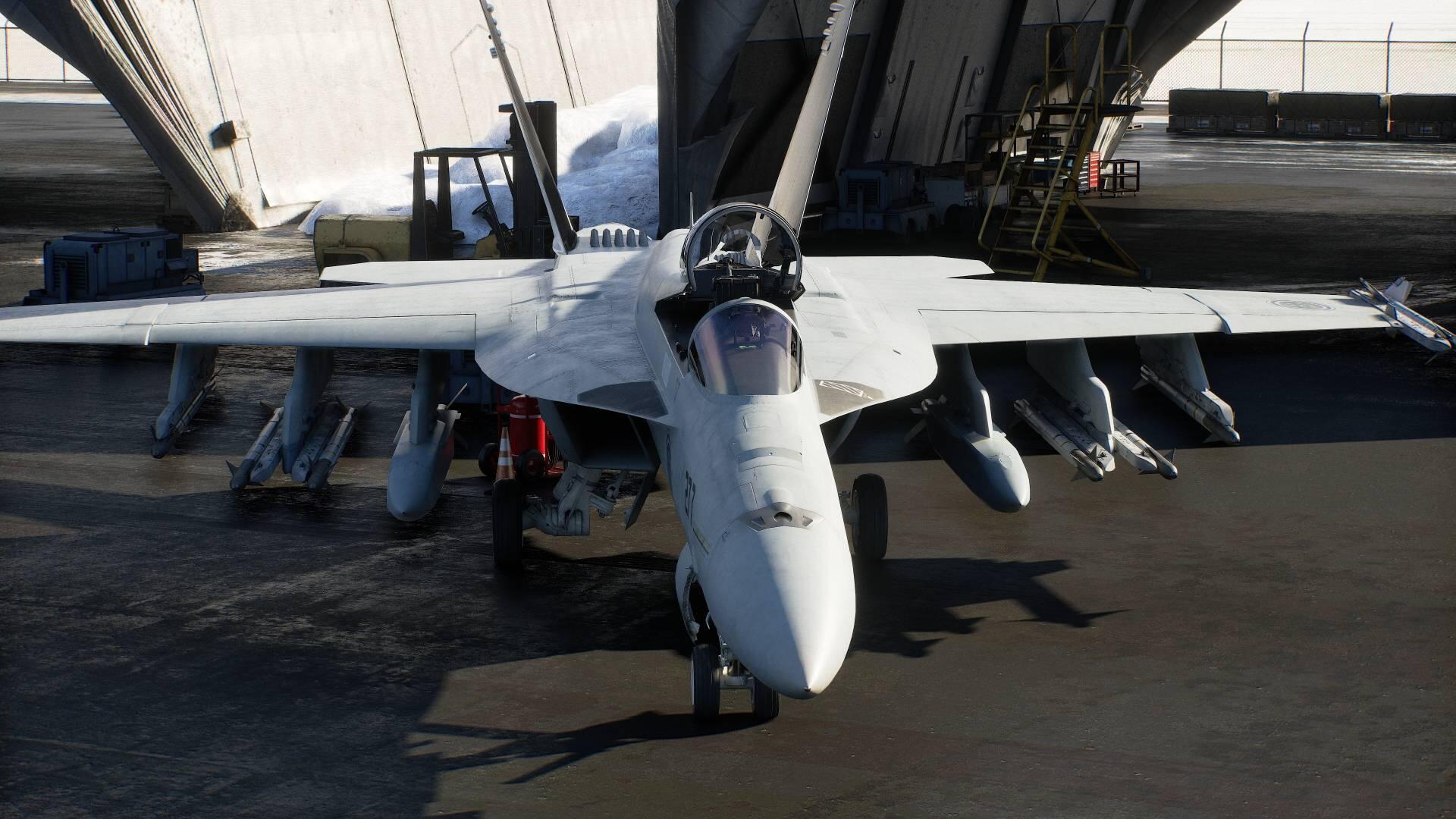 HD PC desktop wallpaper of an Ace Combat 8: Wings of Theve jet fighter, a white military aircraft parked head-on by a hangar with missiles mounted under its wings.