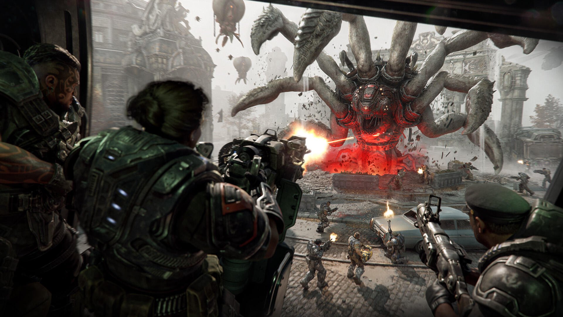 HD PC desktop wallpaper — Gears of War: E-Day battle: soldiers unleash heavy fire on a towering, spider-like Locust with a glowing red core amid a ruined cityscape.
