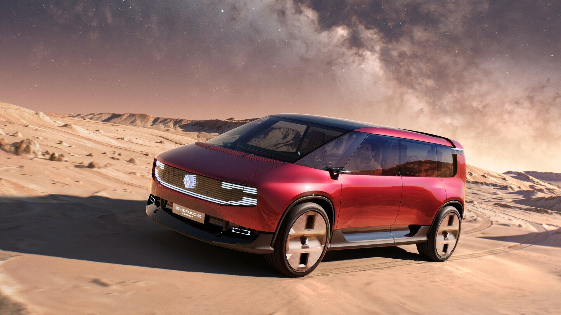Renault E-Space electric SUV driving across a desert landscape, featured in an HD PC desktop wallpaper.