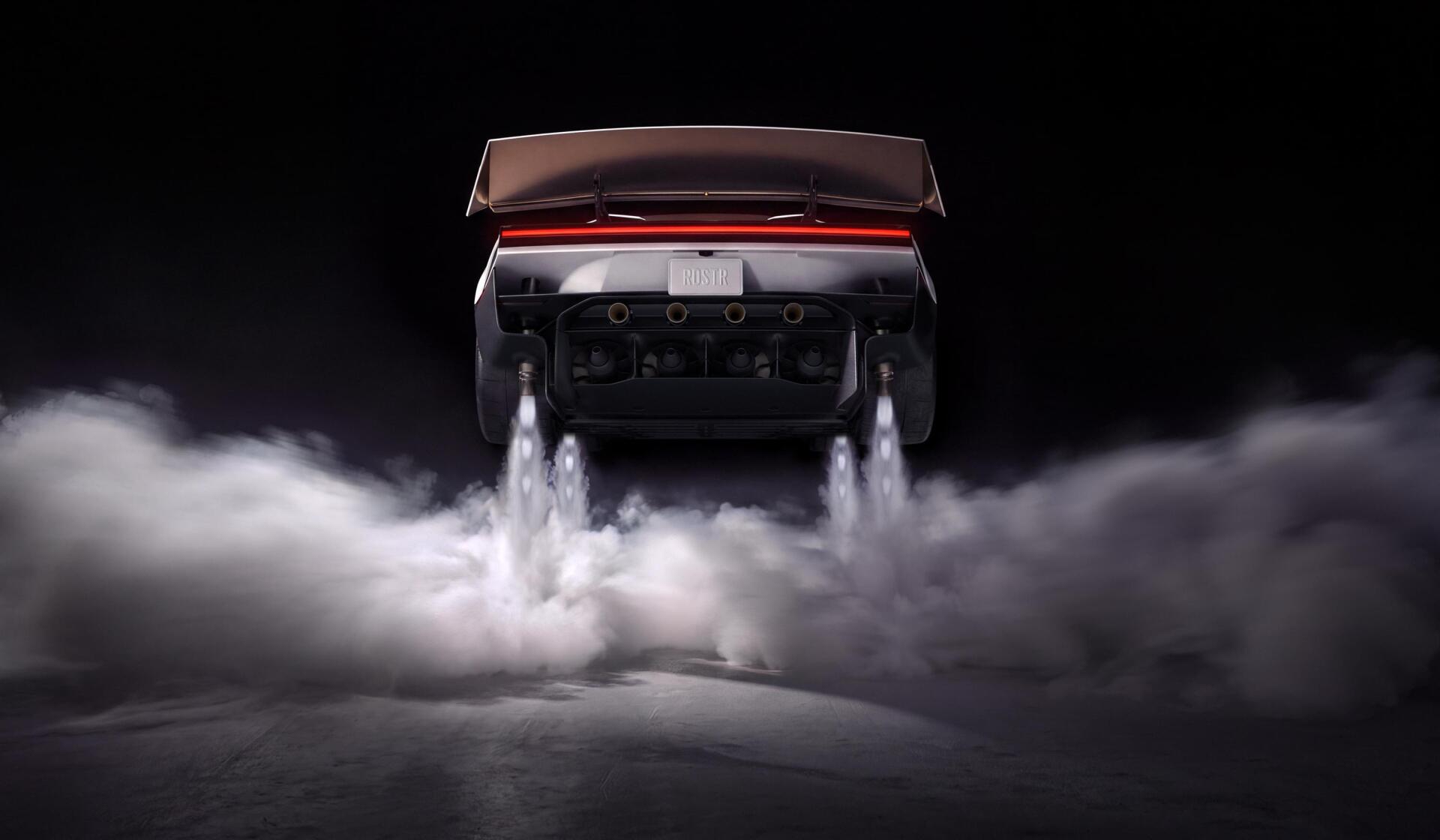 Tesla Roadster launching through clouds of smoke, 2K Quad HD PC desktop wallpaper and background.