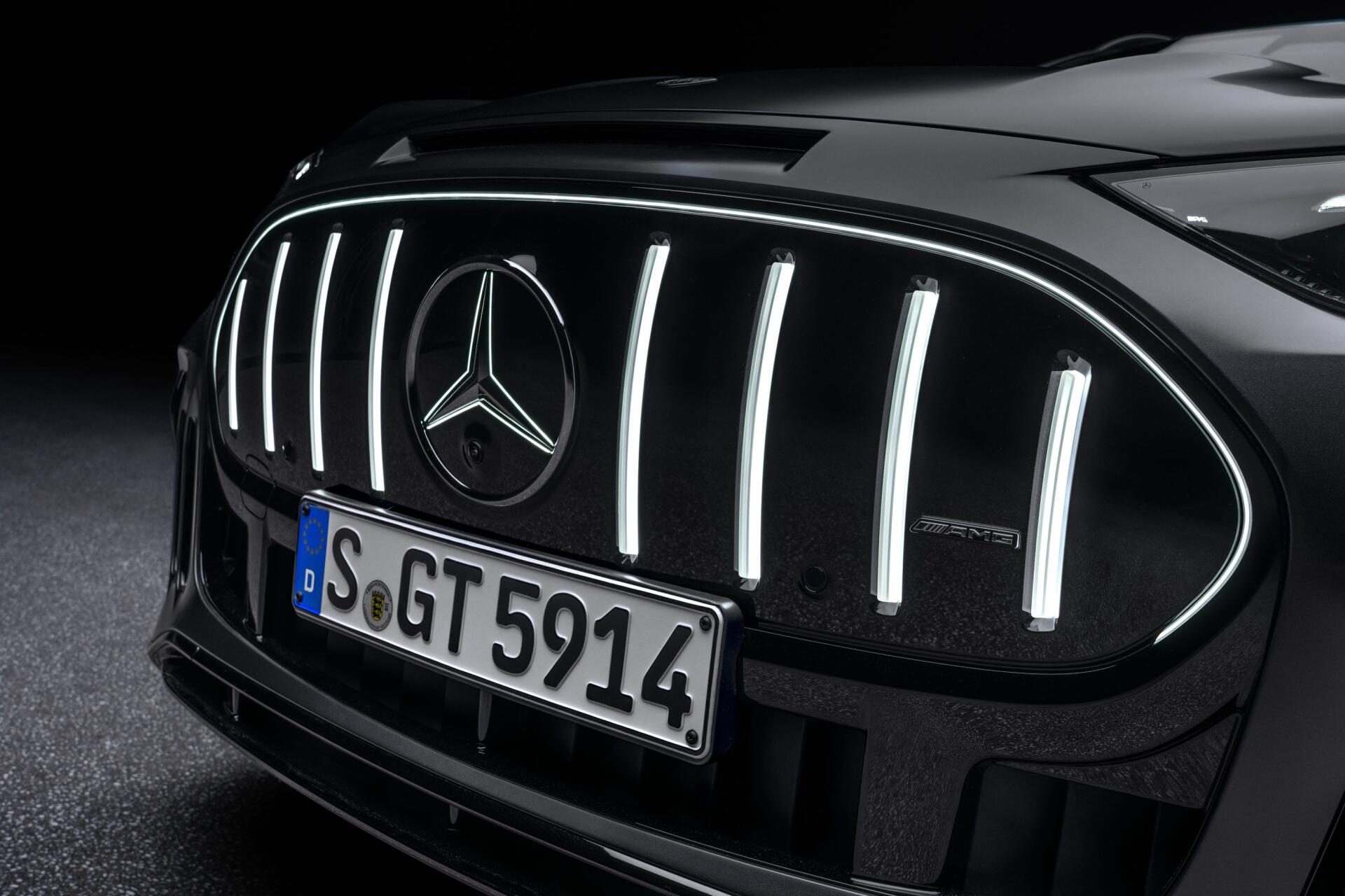 Close-up of a Mercedes-AMG GT SUV grille and Mercedes-Benz emblem, featured in a 2K Quad HD PC desktop wallpaper and background.