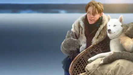 HD PC desktop wallpaper Iron Will — a young person in a fur coat sits with a white husky on a sled against a cold, blue-toned winter landscape.