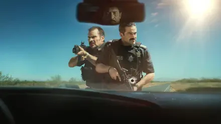 2K Quad HD PC desktop wallpaper titled Facing El Chapo: two armed officers aiming weapons over a car dashboard under a bright, sunlit sky.
