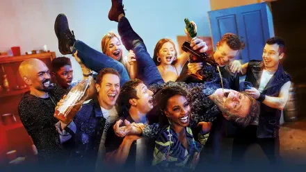 Shameless — 4K Ultra HD PC desktop wallpaper of a rowdy house party: laughing friends lift someone while others pour drinks and cheer under warm, colorful lighting.