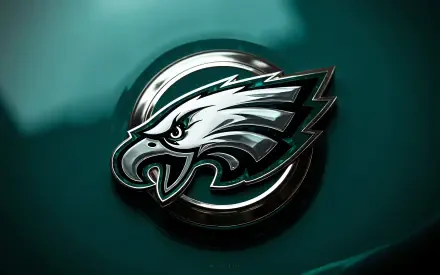 Philadelphia Eagles NFL emblem rendered in metallic 3D centered on an emerald-green abstract background — 4K Ultra HD PC desktop wallpaper.