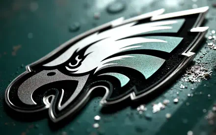 Philadelphia Eagles NFL logo close-up on a textured metallic green surface — 4K Ultra HD PC desktop wallpaper background