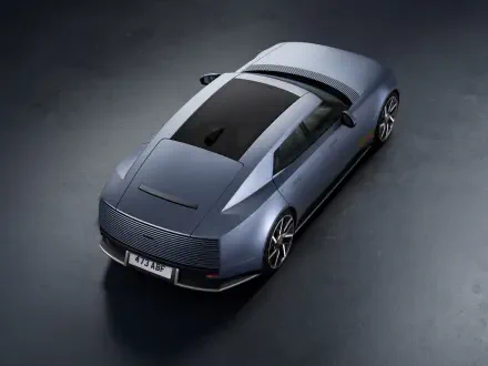 Jaguar Type 01 electric sedan in an 8K Ultra HD desktop wallpaper, viewed from above.