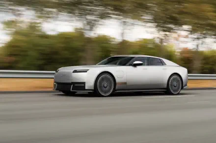 Jaguar Type 01 luxury coupé speeding along a road in a 5K Ultra HD PC desktop wallpaper background.