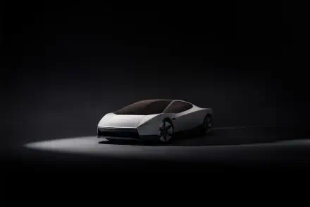 Tesla Roadster electric concept car in a dark studio, featured in a 2K Quad HD PC desktop wallpaper and background.