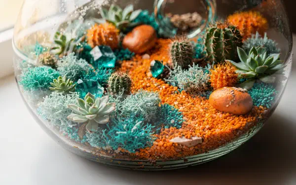 Glass bowl terrarium with cacti and succulents, orange sand paths, turquoise stones and moss — 4K Ultra HD PC desktop wallpaper and background.