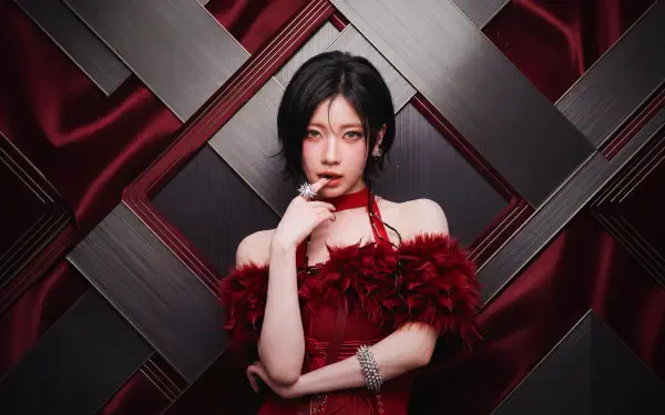 5K desktop wallpaper: Japanese model styled as a k-pop idol with BABYMONSTER-inspired vibe, red feathered dress against a geometric dark backdrop, Ada Wong flair.