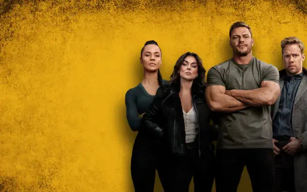 Reacher 4K Ultra HD PC desktop wallpaper: four characters stand defiantly against a textured yellow wall, a broad-shouldered man with crossed arms at the center.