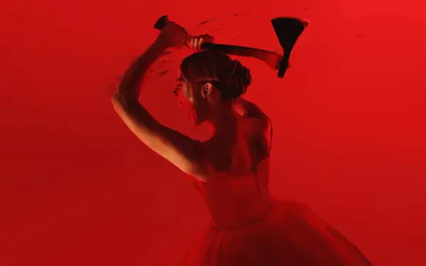 2K Quad HD PC wallpaper for Monster: The Lizzie Borden History — crimson-lit woman in a dress raising an axe above her head against a red background.