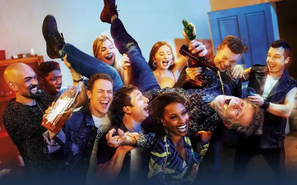 Shameless — 4K Ultra HD PC desktop wallpaper of a rowdy house party: laughing friends lift someone while others pour drinks and cheer under warm, colorful lighting.