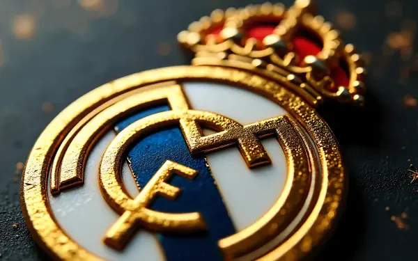 4K Ultra HD PC desktop wallpaper: close-up of Real Madrid C.F. gold-and-blue crest with crown, textured metallic detail on dark background — soccer club emblem for sports fans.