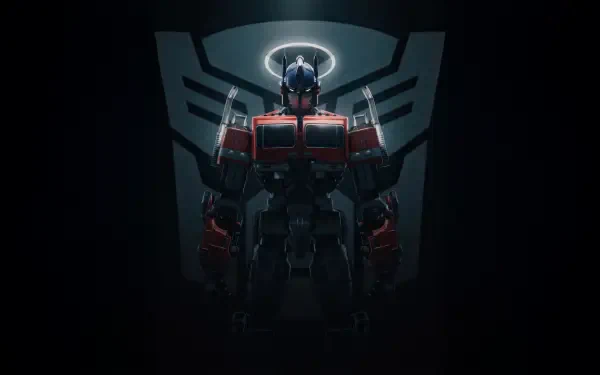 Transformers movie digital art: imposing red-and-blue Transformer standing before a glowing Autobot emblem — 5K Ultra HD PC desktop wallpaper background