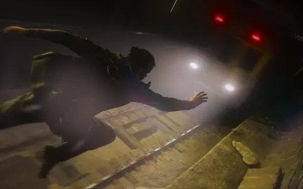 Control Resonant — Dylan Faden falling through a foggy, dimly lit corridor toward oncoming headlights; 4K Ultra HD PC desktop wallpaper/background