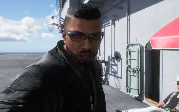 Ace Combat 8: Wings of Theve HD PC desktop wallpaper: close-up of a man with close-cropped hair and sunglasses in a tactical jacket standing on an aircraft carrier deck under blue sky.