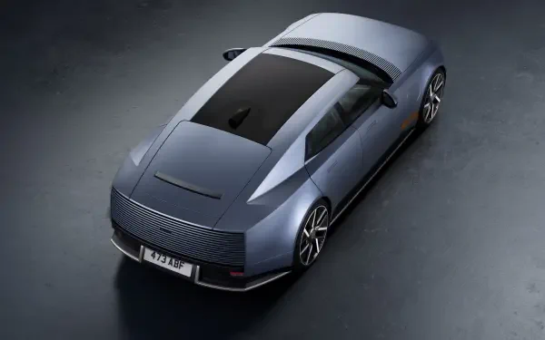 Jaguar Type 01 electric sedan in an 8K Ultra HD desktop wallpaper, viewed from above.
