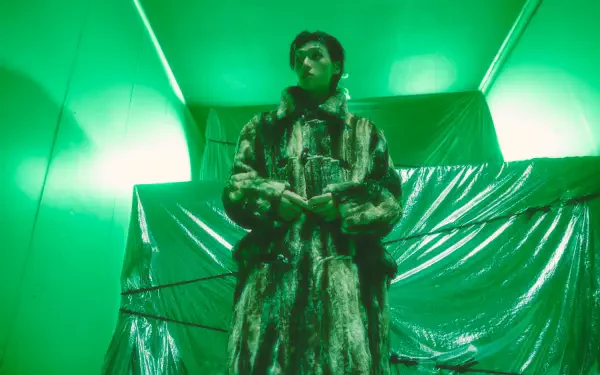 ATEEZ Wooyoung in a monster costume under vivid green lights, from Golden Hour — 4K Ultra HD desktop wallpaper and background.