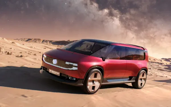 Renault E-Space electric SUV driving across a desert landscape, featured in an HD PC desktop wallpaper.