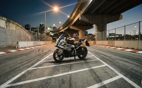 BMW Motorrad F 450 RR sport motorcycle on an urban street beneath elevated highways, 4K Ultra HD desktop wallpaper background.