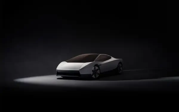 Tesla Roadster electric concept car in a dark studio, featured in a 2K Quad HD PC desktop wallpaper and background.