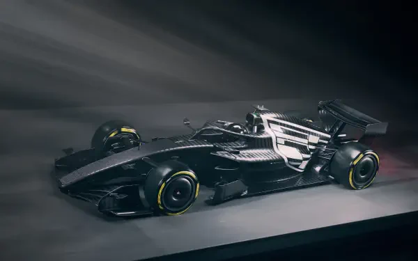 Cadillac MAC-26 Formula One race car in a dramatic studio scene, 2K Quad HD PC desktop wallpaper and background.