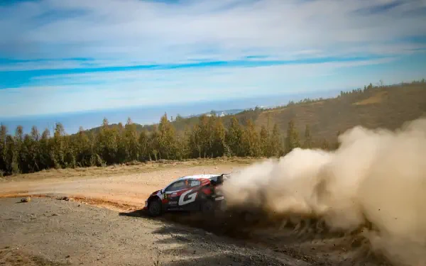 Toyota Gazoo Racing GR Yaris Rally1 powers through a dusty WRC rally stage in this 5K Ultra HD desktop wallpaper.