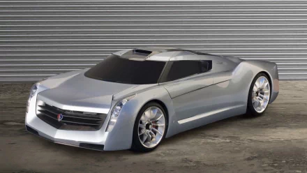 HD PC desktop wallpaper showing a silver Cadillac concept vehicle parked in front of a corrugated metal background.