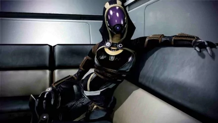 HD PC desktop wallpaper featuring Tali'Zorah from the video game Mass Effect 3, showcasing her in detailed armor sitting casually in a futuristic interior.