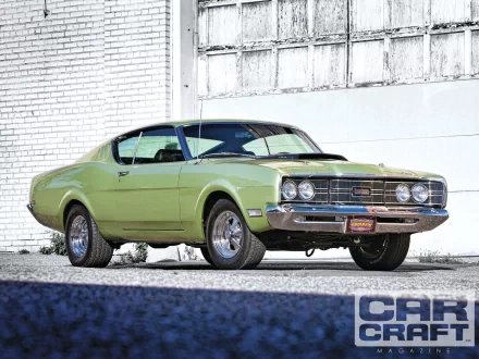 1969 Mercury Cyclone in green, showcased as a HD PC desktop wallpaper and background featuring classic vehicle design against an industrial backdrop.