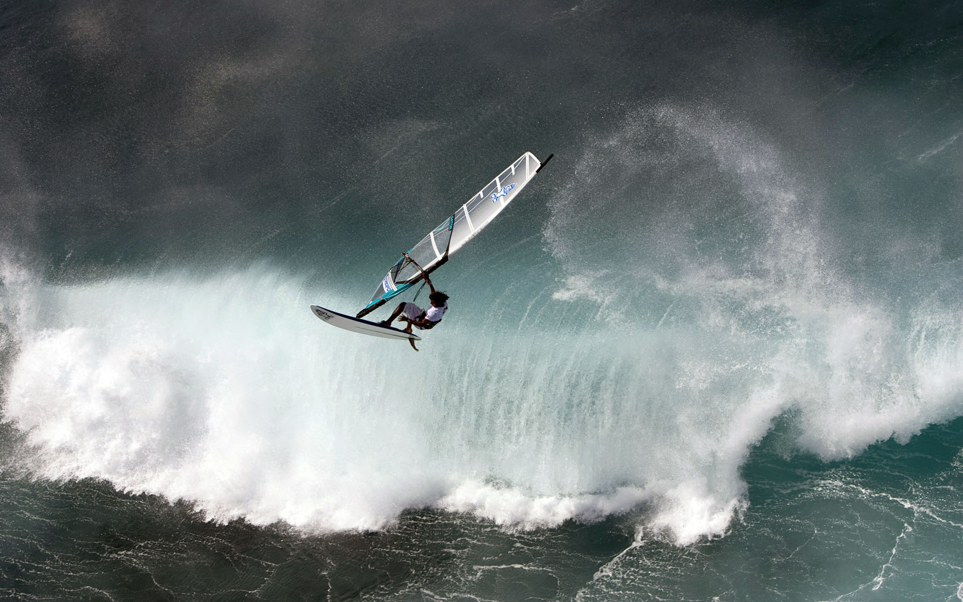 A thrilling windsurfing action scene, capturing the adrenaline and grace of these water sport enthusiasts.