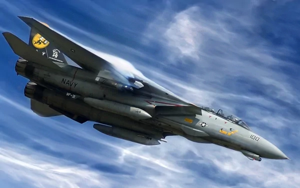 HD PC desktop wallpaper showing a Grumman F-14 Tomcat military jet banking through dramatic cloudy blue skies.