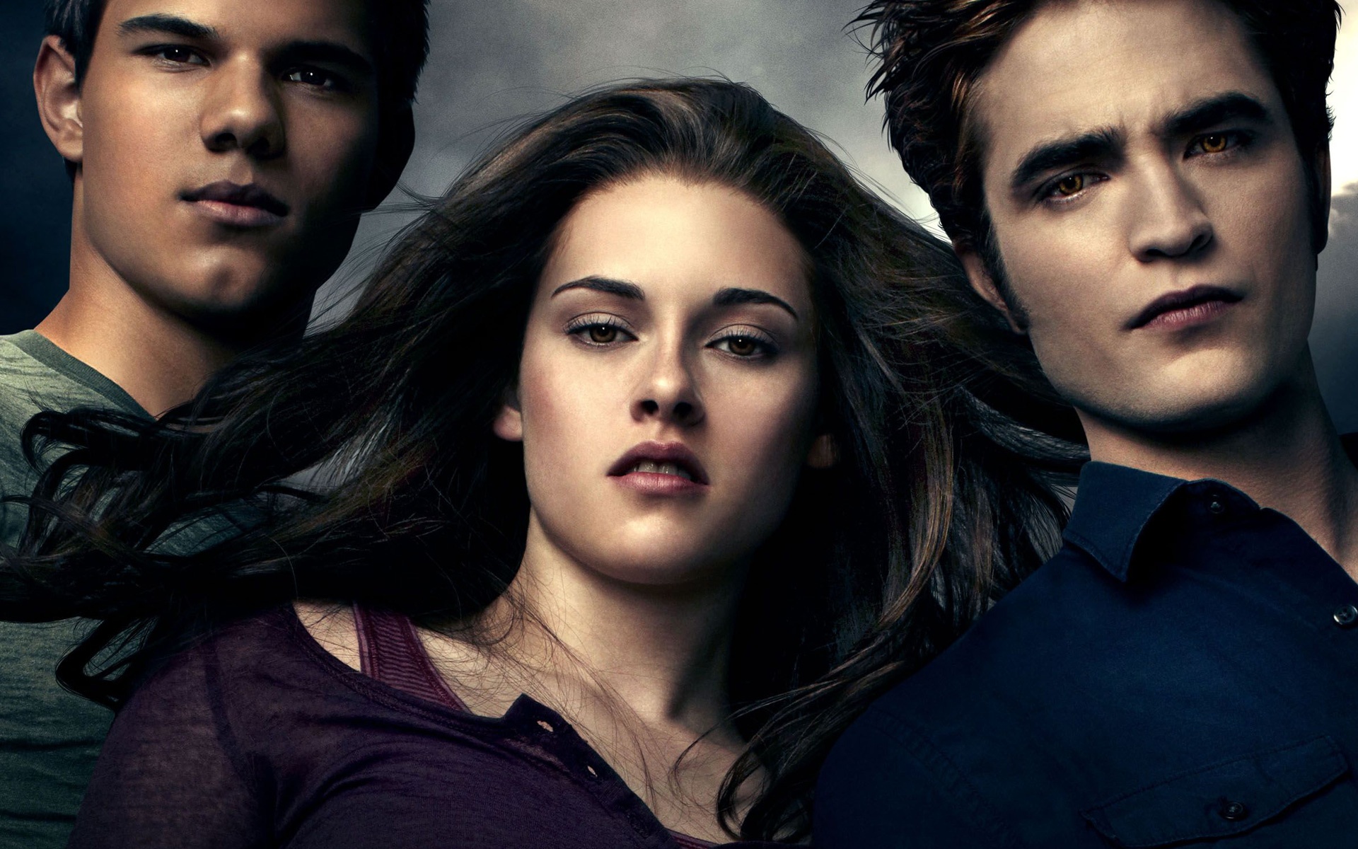 Bella Swan stands between Edward Cullen and Jacob Black in this Twilight movie scene.