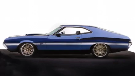 Side-profile of a blue 1972 Ford Gran Torino with chrome trim and alloy wheels on a dark reflective surface — HD PC desktop wallpaper/background.