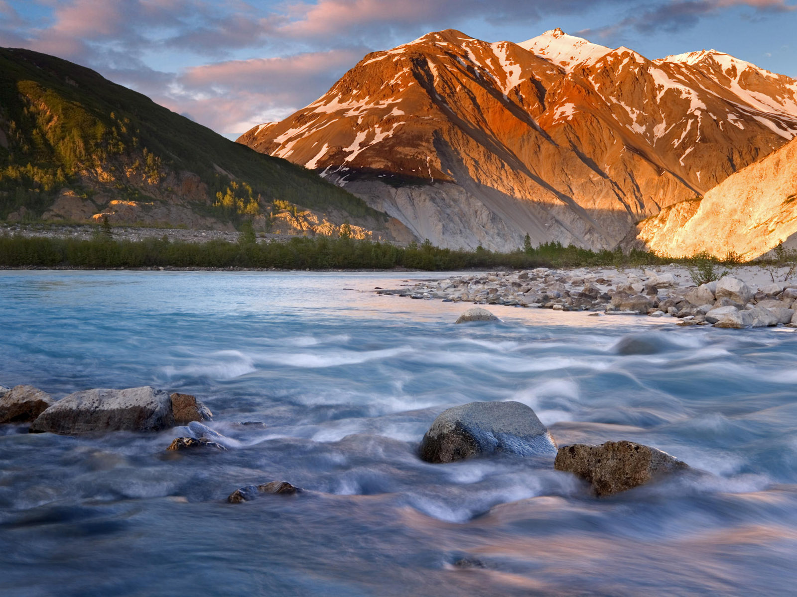 Alaskan river flowing with serene water.