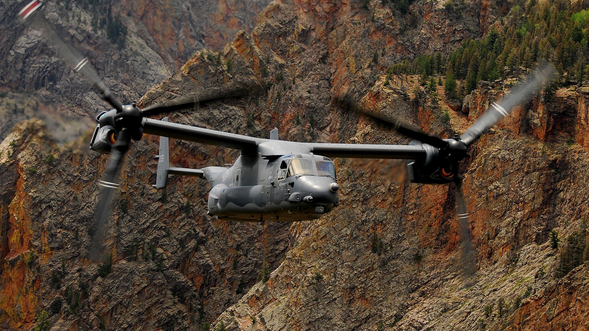 Military aircraft flying in the sky - Bell Boeing V-22 Osprey.