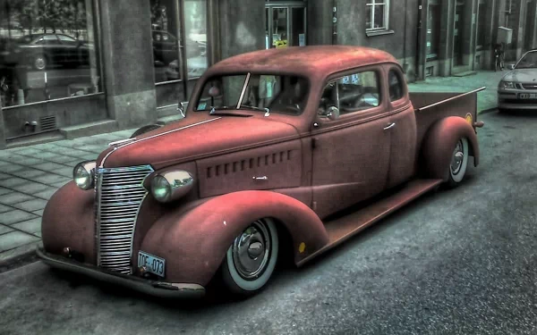 A vintage red truck parked on a city street, captured in sharp detail as a 4K Ultra HD PC desktop wallpaper and background.