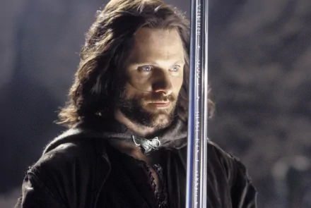 A striking HD wallpaper from *The Lord of the Rings: The Return of the King*, featuring Aragorn with a sword, showcasing determination and bravery in an epic fantasy setting.