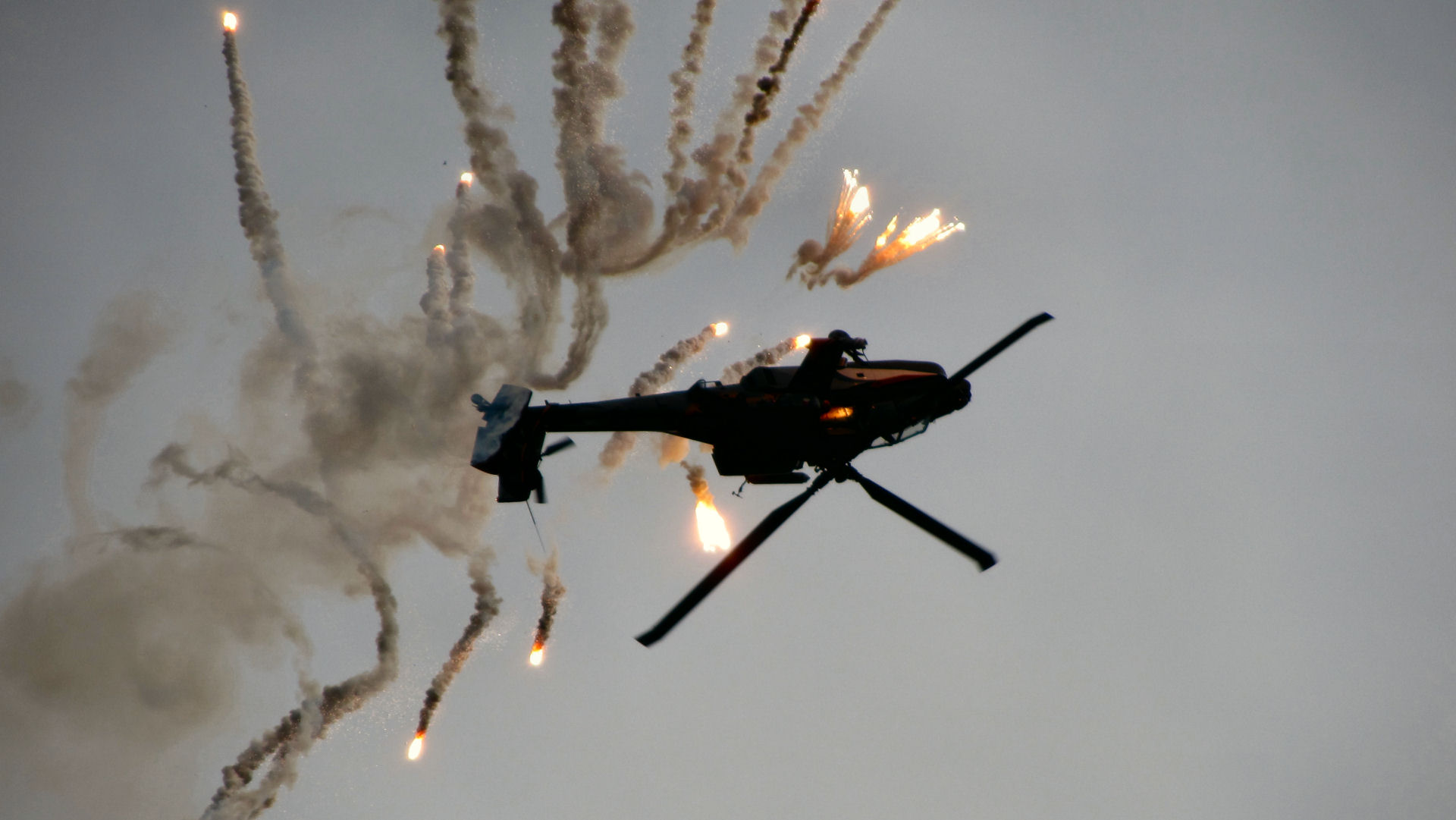 Dutch Apache helicopter releasing flares, taken by Iffick.