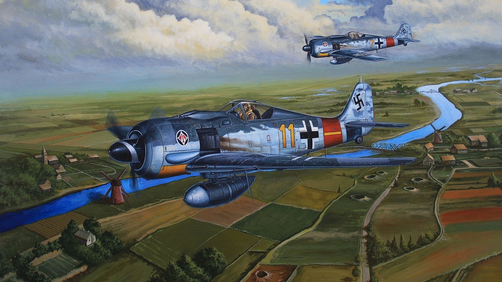HD PC desktop wallpaper featuring detailed military aircraft flying over a scenic rural landscape under a cloudy sky.