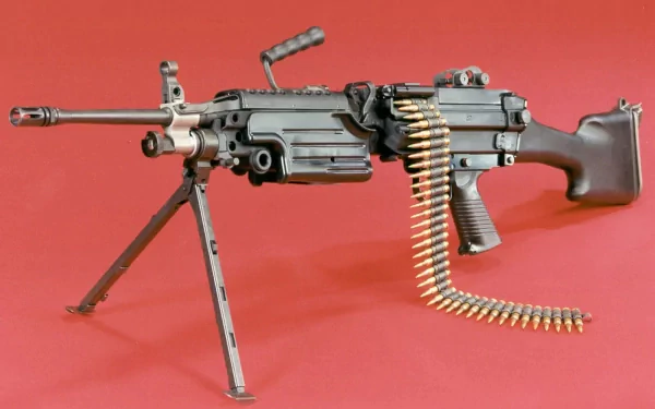 A high-definition desktop wallpaper featuring a detailed image of a machine gun against a red background, showcasing its intricate design and craftsmanship.