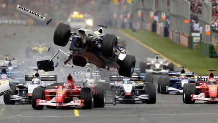 An intense Formula 1 race scene captures a car flipping in the air amidst a competitive field, highlighting the excitement and drama of F1 sports in a dynamic HD wallpaper.