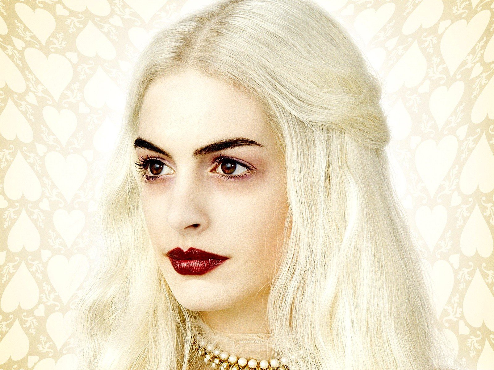 Close-up of an actress as the White Queen from Alice in Wonderland (2010), pale skin, platinum hair and dark red lips — HD PC desktop wallpaper/background.