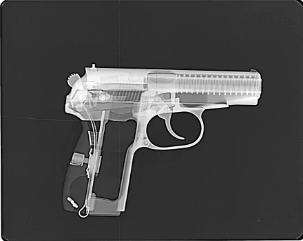 An X-ray image of a pistol, showcasing its internal components, presented as an artistic HD PC desktop wallpaper and background with military themes.