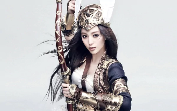 HD PC desktop wallpaper featuring fantasy warrior Fan Bingbing in detailed armor, holding a bow, embodying strength in a striking fantasy setting.