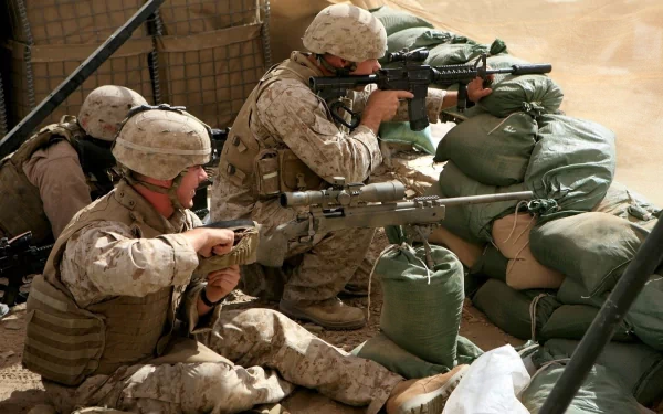 U.S. Army Infantry soldiers armed with rifles in a combat position behind sandbags, showcasing military readiness in a war setting.